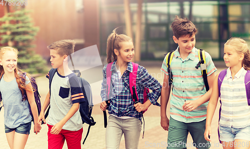 Image of group of happy elementary school students walking