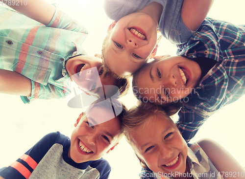 Image of group of happy children faces in circle