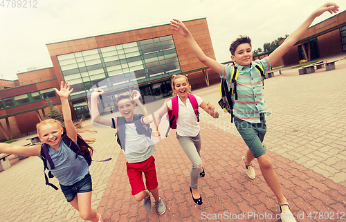 Image of group of happy elementary school students running