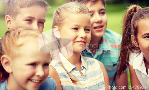 Image of group of happy kids or friends outdoors