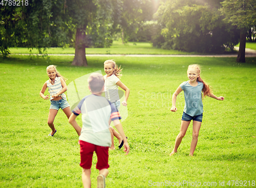 Image of happy kids running and playing game outdoors