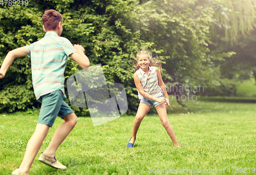 Image of happy kids running and playing game outdoors