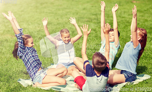 Image of group of happy kids or friends outdoors