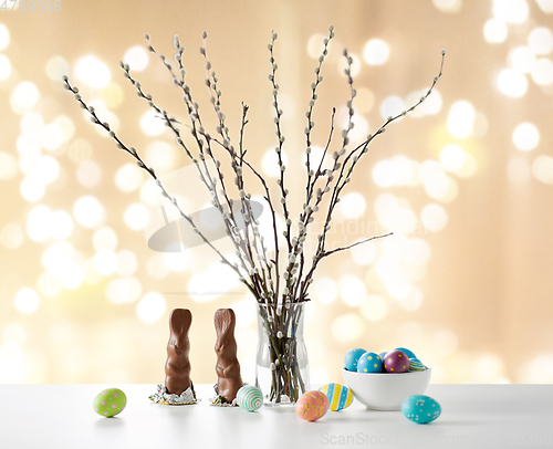 Image of pussy willow, easter eggs and chocolate bunnies