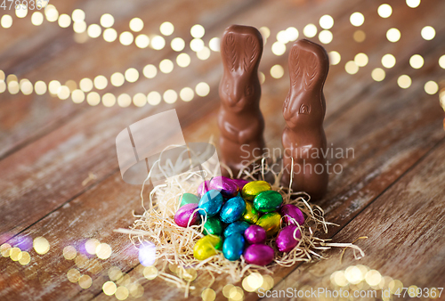 Image of easter eggs in straw nest and chocolate bunnies