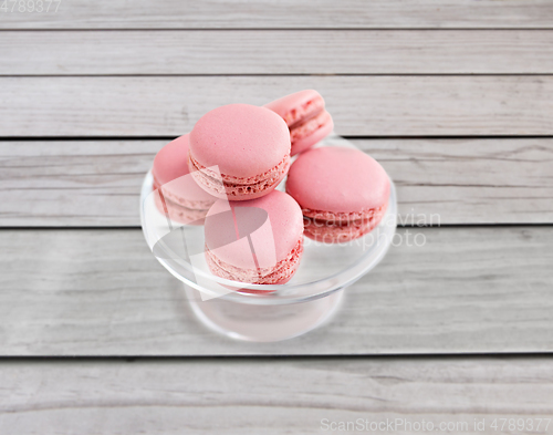 Image of pink macaroons on glass confectionery stand