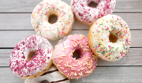 Image of close up of glazed donuts on grey boards