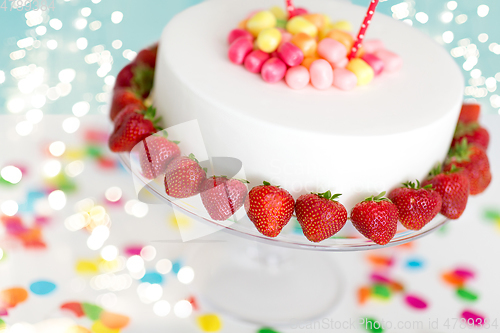 Image of close up of birthday cake with strawberries