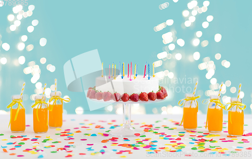 Image of birthday cake, juice, popcorn and marshmallow