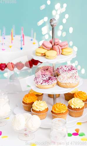 Image of food and drinks on table at birthday party