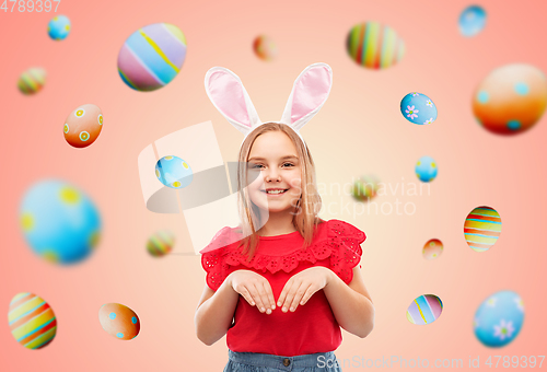 Image of happy girl wearing easter bunny ears headband