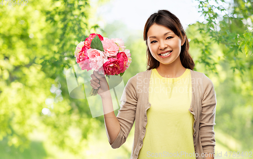 Image of happy asian woman with bunch of flowers