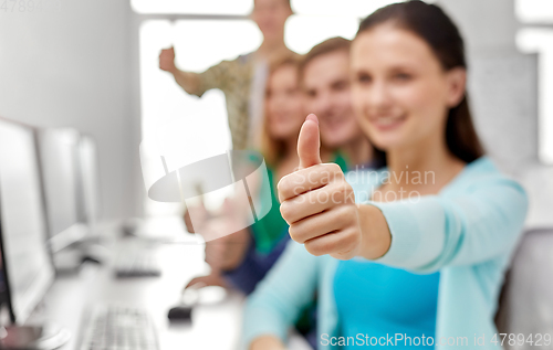 Image of group of happy students showing thumbs up