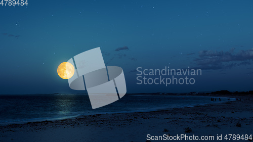 Image of full moon over the ocean