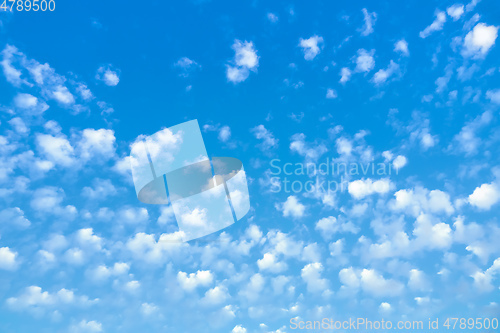 Image of blue sky with lots of small clouds