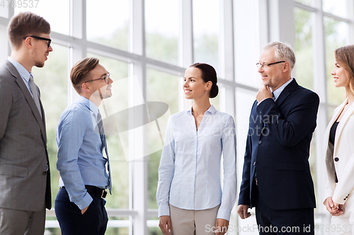 Image of business people talking at office building