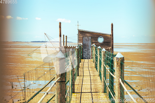 Image of Hut of fisherman and jetty in the bay