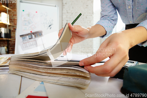 Image of Interior designer working with colour palette in modern office