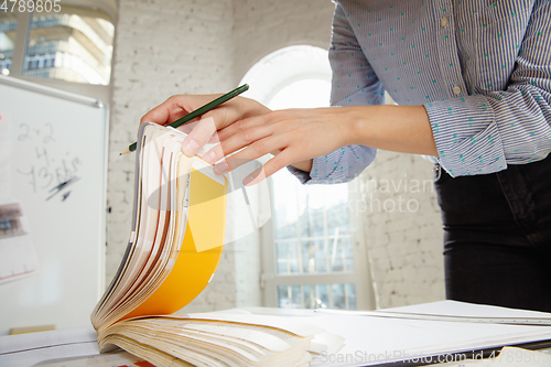 Image of Interior designer working with colour palette in modern office