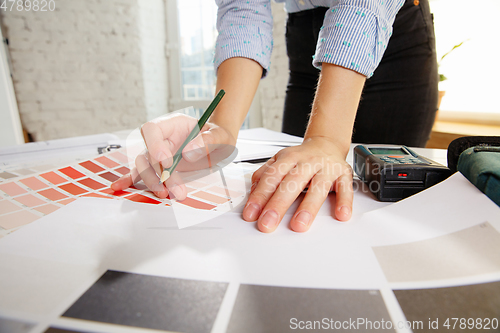 Image of Interior designer working with colour palette in modern office