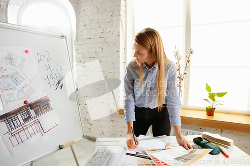 Image of Interior designer working with colour palette in modern office