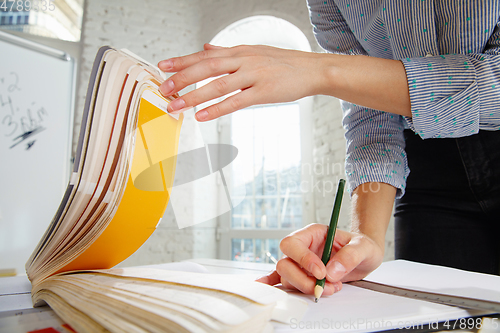 Image of Interior designer working with colour palette in modern office