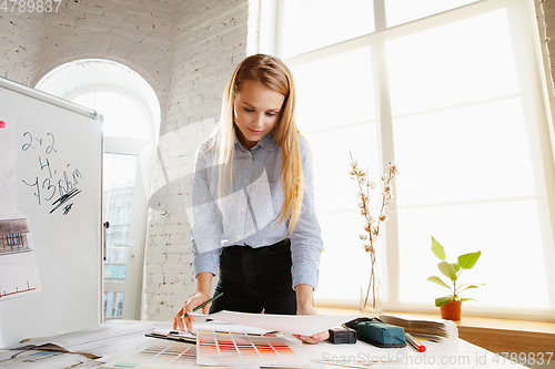 Image of Interior designer working with colour palette in modern office