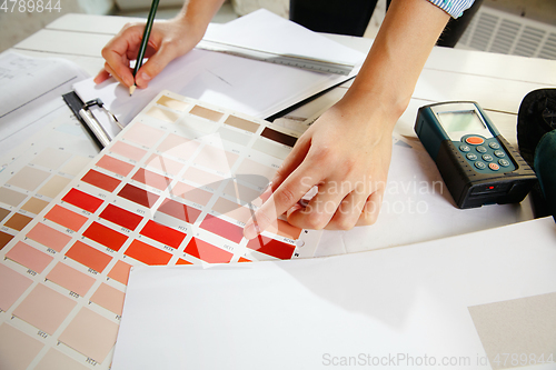 Image of Interior designer working with colour palette in modern office