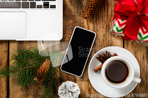 Image of Mock up blank empty screen of smartphone on wooden background