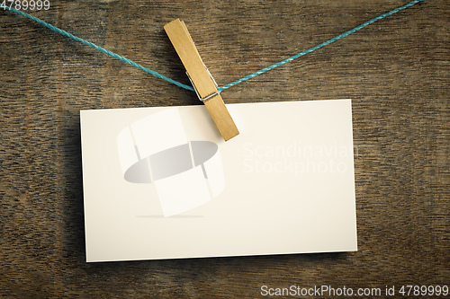 Image of card on wire with clothes peg