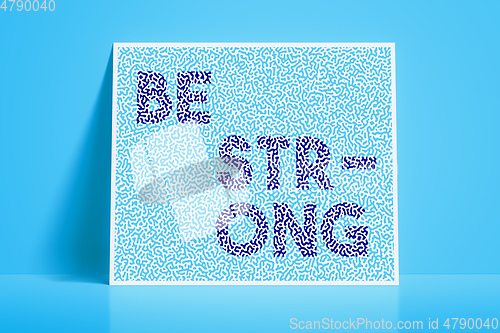 Image of textured card with the word be strong