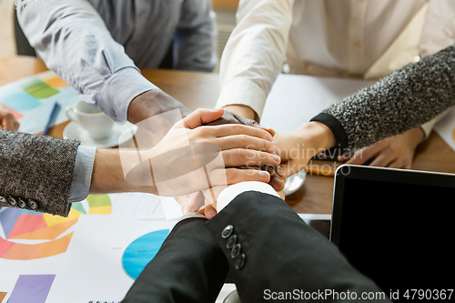 Image of Group of young business professionals having a meeting, creative office