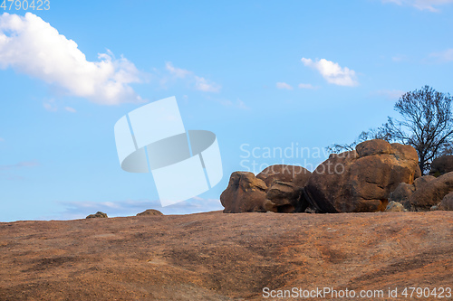 Image of rock and blue sky background