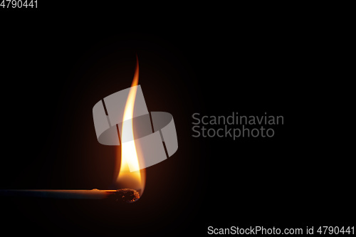 Image of match flame dark background