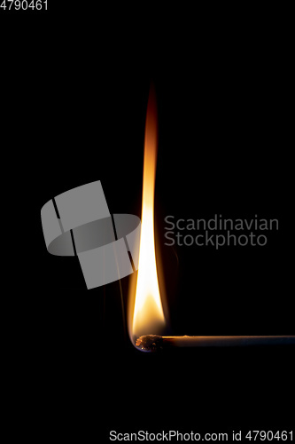 Image of match flame dark background