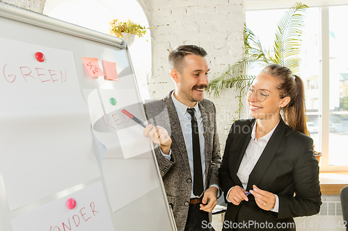 Image of Young business professionals having a meeting, creative office