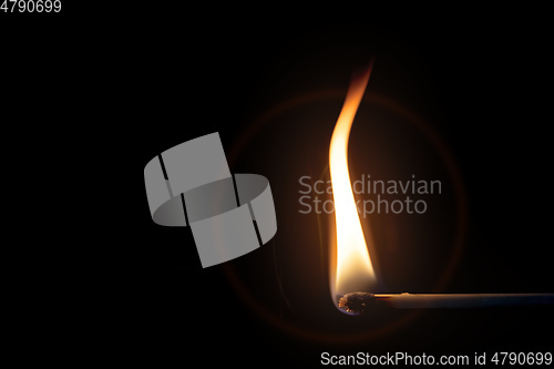 Image of match flame dark background