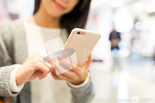 Image of Woman working on cellphone