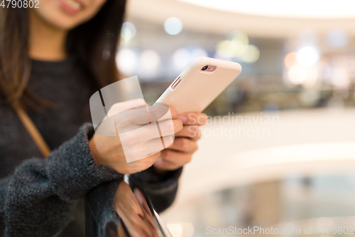 Image of Woman working on mobile phone