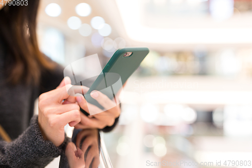 Image of Woman using cellphone