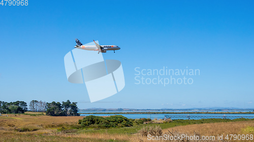 Image of Jetstar airplane is landing at the Auckland Airport