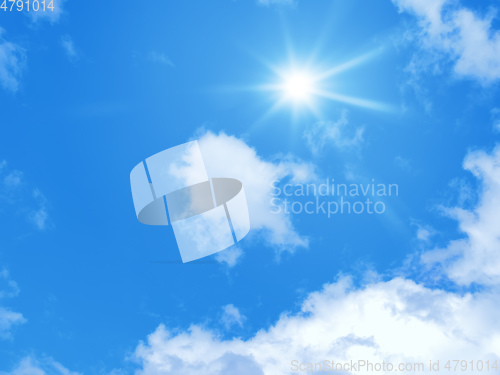 Image of typical blue sky with sun and clouds background