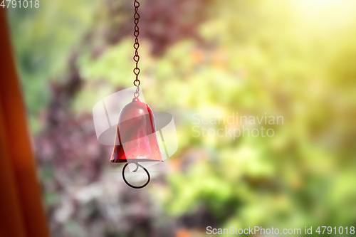 Image of red color bell in the garden with bokeh background