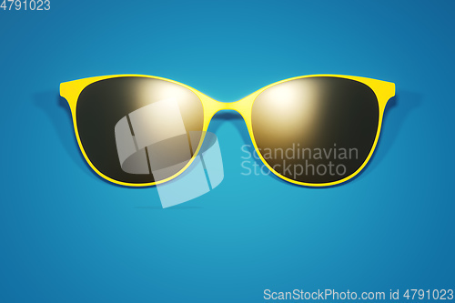 Image of yellow glasses on blue background