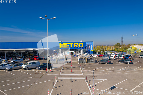 Image of Metro retail store, large shopping mall of household and food goods with parking, aerial view, copyspace