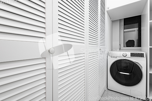 Image of White utility room with big closet in new apartment