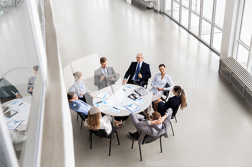 Image of business team with scheme meeting at office