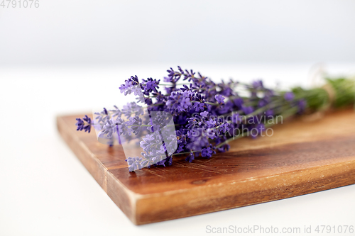 Image of bunch of lavender flowers on wooden board