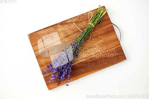 Image of bunch of lavender flowers on wooden board