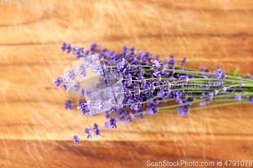 Image of bunch of lavender flowers on wooden board